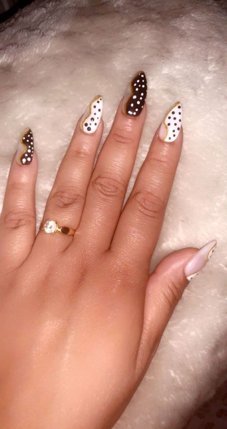 Chic Neutral Toned Nail Design with Polka Dots and Gold Accents