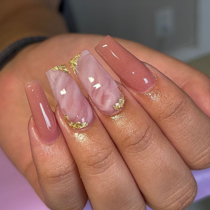 Luxurious Soft Pink and Marble Nail Design with Gold Accents for Any Occasion