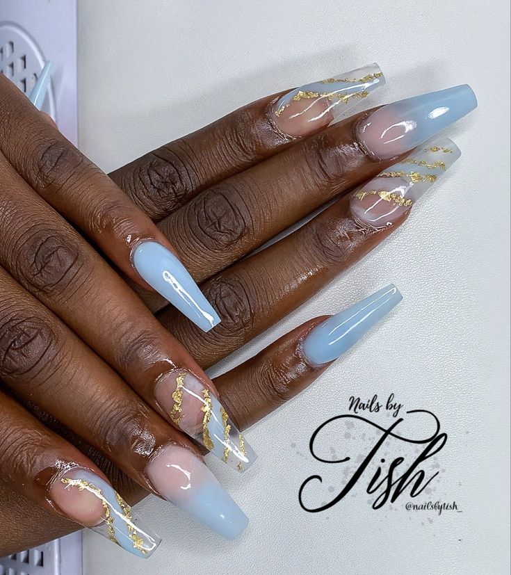 Elegant Soft Blue Nail Design with Gold Accents for a Modern Look.