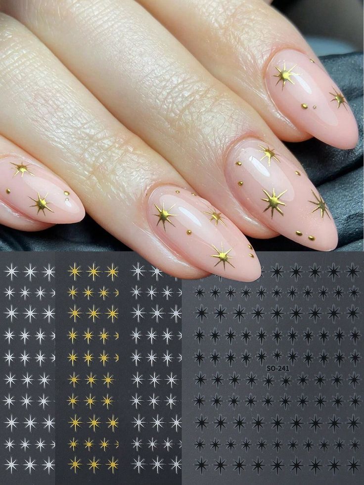 Chic Celestial-Inspired Nail Design: Soft Nude Base with Shimmering Gold Stars.