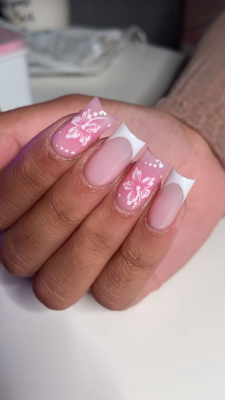 Elegant Pastel Pink Nail Art with Intricate Floral Designs and Whimsical Accents