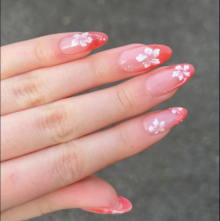 Elegant Floral Nail Design with Soft Pink Base and Coral Tips