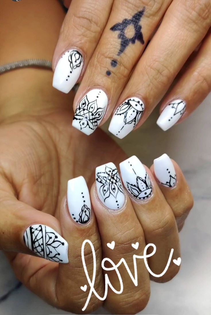 Elegant Glossy White Nail Design with Intricate Black Line Art and Modern Square Tips.