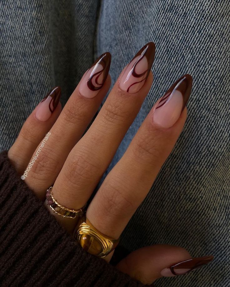 Chic Almond-Shaped Nail Design: Sophisticated Nude and Deep Brown Hues with Elegant Swirls