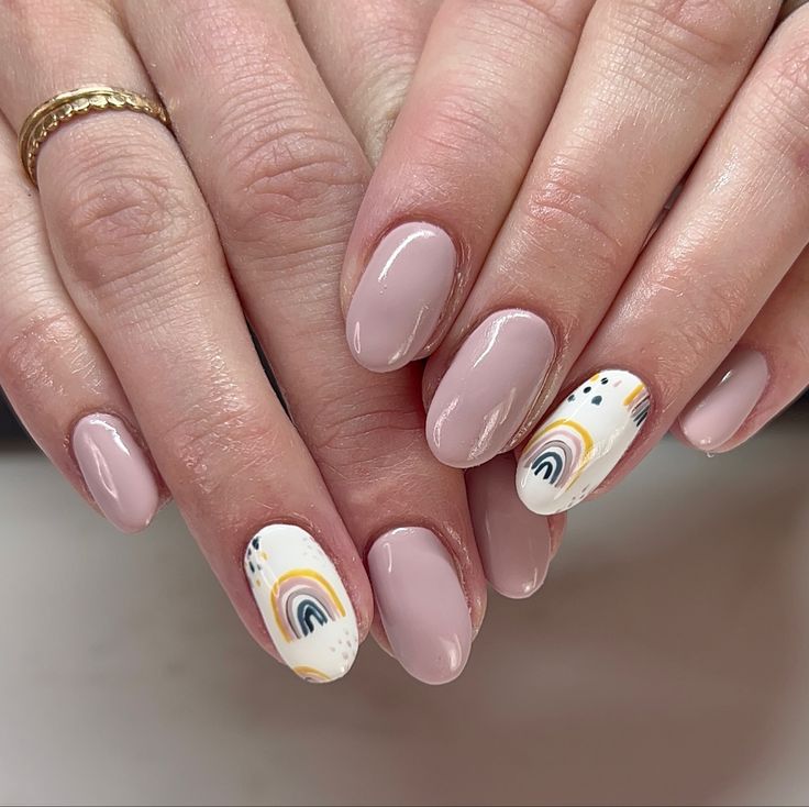 Elegant Blush Pink Nail Design with Playful Rainbow Accent.