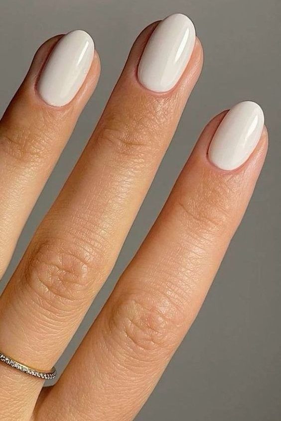 Chic and Timeless Elegant Almond-Shaped Nails in Creamy White Polish.