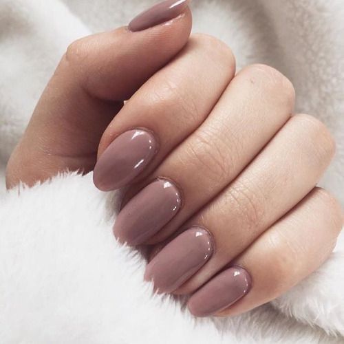 Sophisticated Almond-Shaped Nails in Glossy Mauve: A Chic Fusion of Elegance and Warmth.