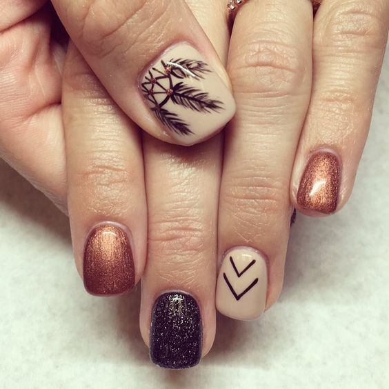 Elegant Earthy Toned Nail Design with Intricate Patterns and Nature-Inspired Motifs.