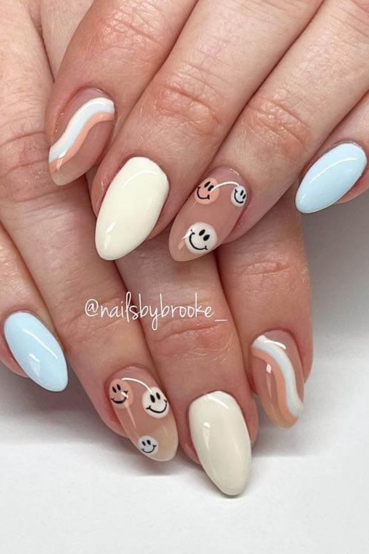 Whimsical Pastel Nail Design with Cheerful Smiley Faces and Dynamic Waves