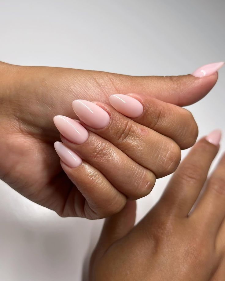 Chic Soft Pink Almond-Shaped Nails: Elegant and Versatile Nail Art for Any Occasion.