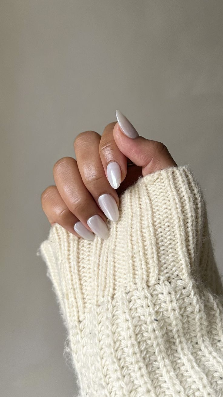 Sophisticated Almond-Shaped Nails in Creamy White: A Perfect Blend of Chic and Comfort.