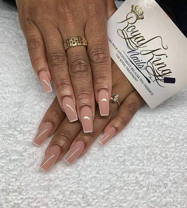 Chic Elegant Nude Nails with Stylish French Tips and Glamorous Accents