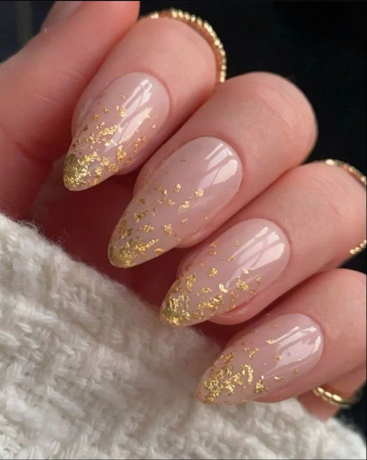 Chic Elegant Nude Nails with Gold Flakes and Geometric Almond Shape.