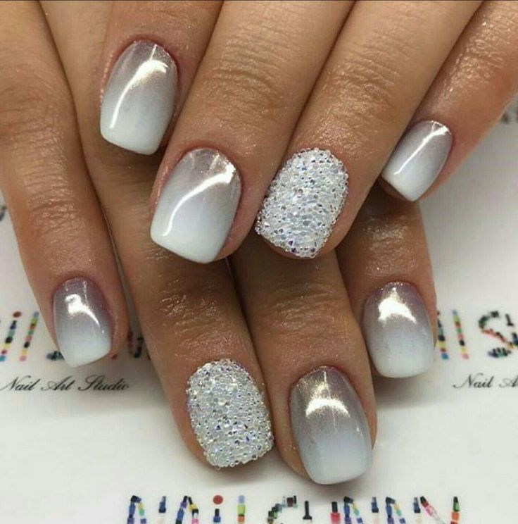 Elegant Ombre Nail Design with White and Silver Gradient and Glamorous Glitter Accents