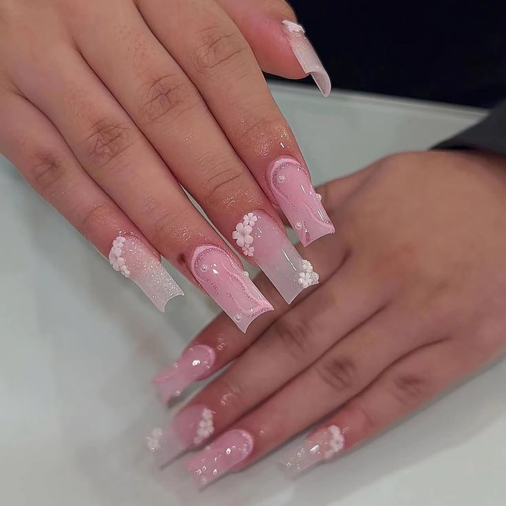 Sophisticated Floral Pink Coffin Nail Design with Pearl Accents