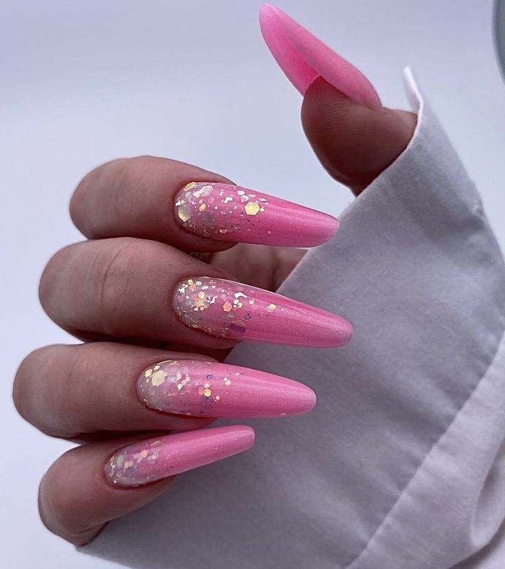 Elegant Stiletto Pink Nails with Glossy Finish and Gold Accents