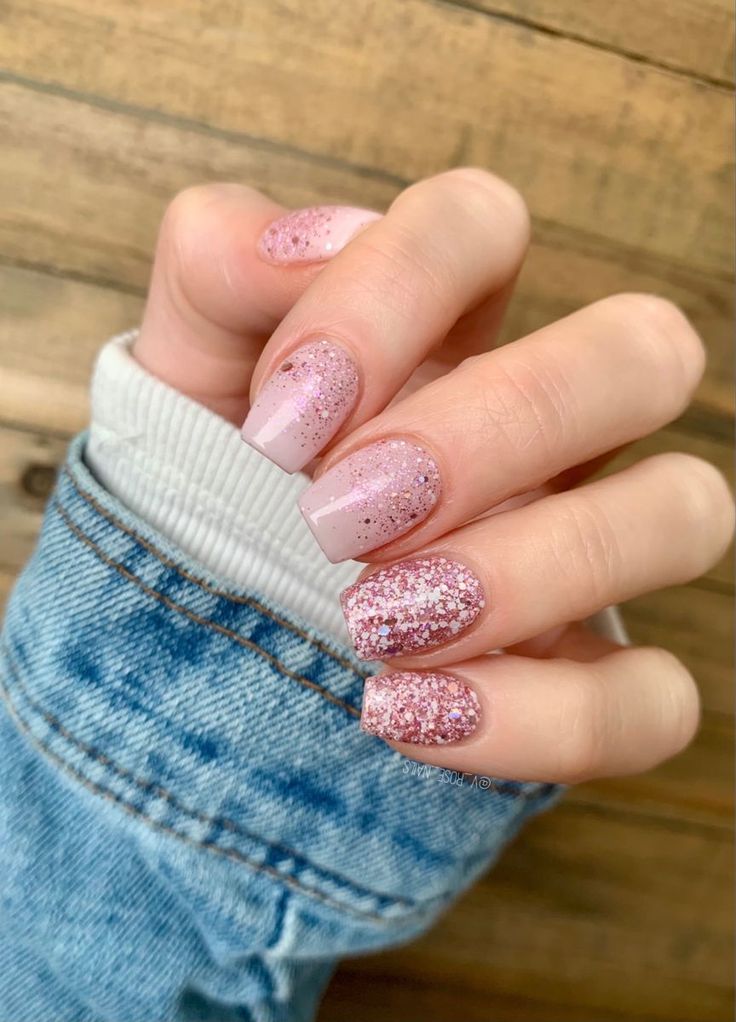 Elegant Sparkly Pink Gradient Nail Design with Glitter Accents