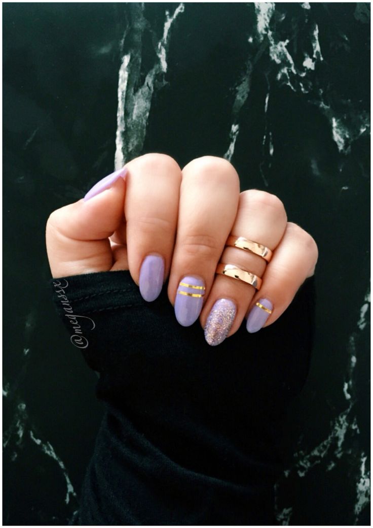 Chic Lavender Nails with Gold Stripes and Glamorous Accent Design.