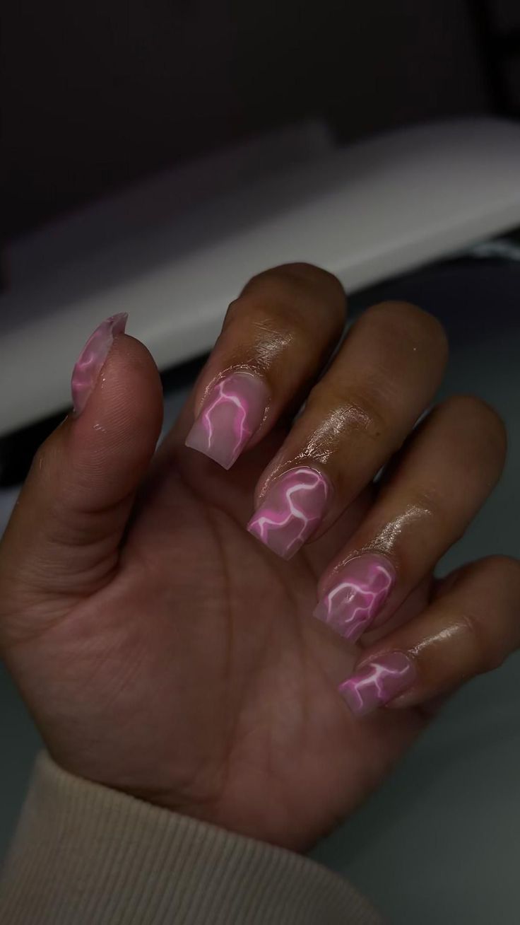 Elegant Pink Marble Nails with Translucent Base and Glossy Finish