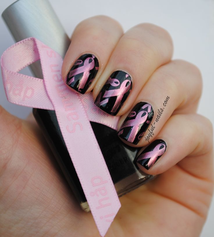 Striking Black Nail Design with Delicate Pink Ribbons Symbolizing Awareness.