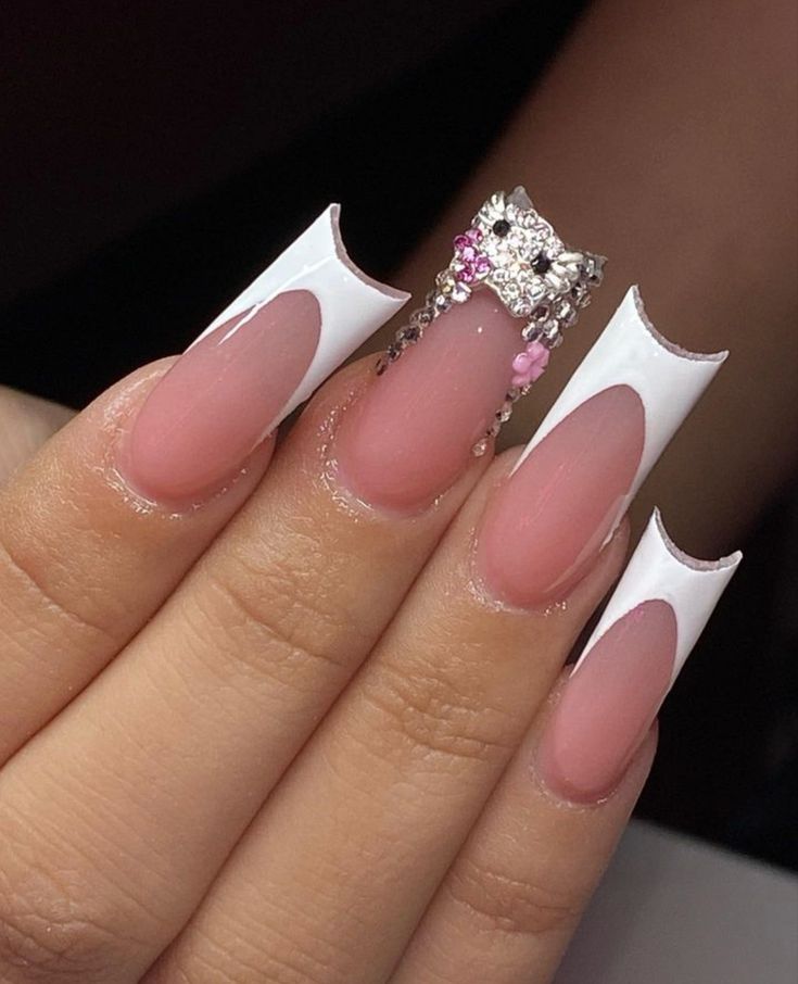 Chic Nude and White Nail Design with Modern Cut-Outs and Glamorous Accents