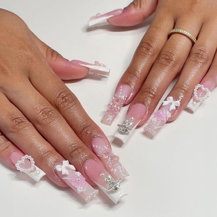 Sophisticated Pink and White Long Square Nail Design with Intricate Embellishments.