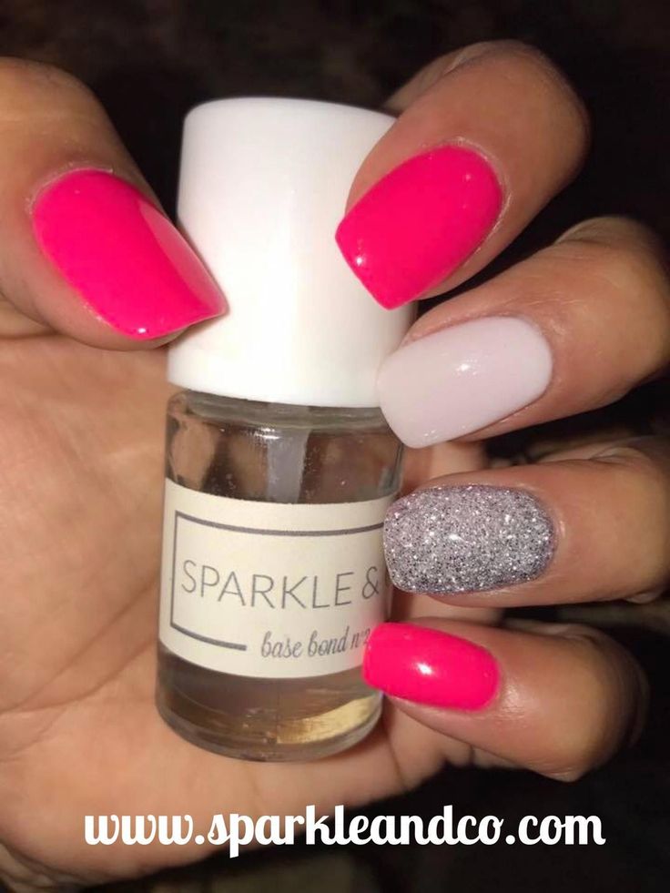 Playful and Stylish Nail Design: Bold Pink, Clean White, and Glittering Silver Accent