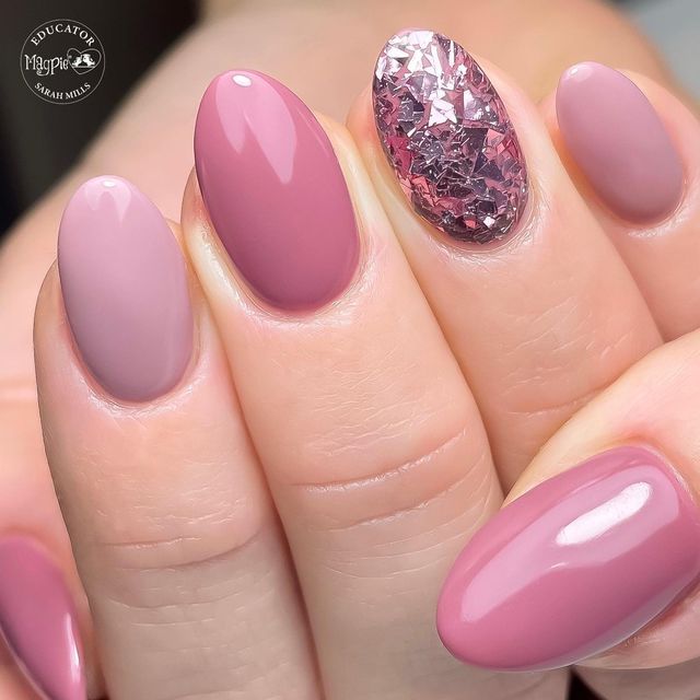 Sophisticated Manicure: Elegant Soft Pink Nail Design with Sparkling Pink Foil Accent.