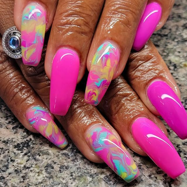 Vibrant Pink Marble Nail Design with Pastel Swirls and Elegant Tapered Shapes.