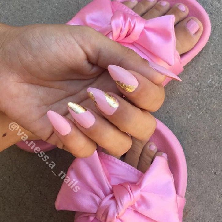 Chic Soft Pink Manicure with Glossy Gold Accents for a Sophisticated Look.