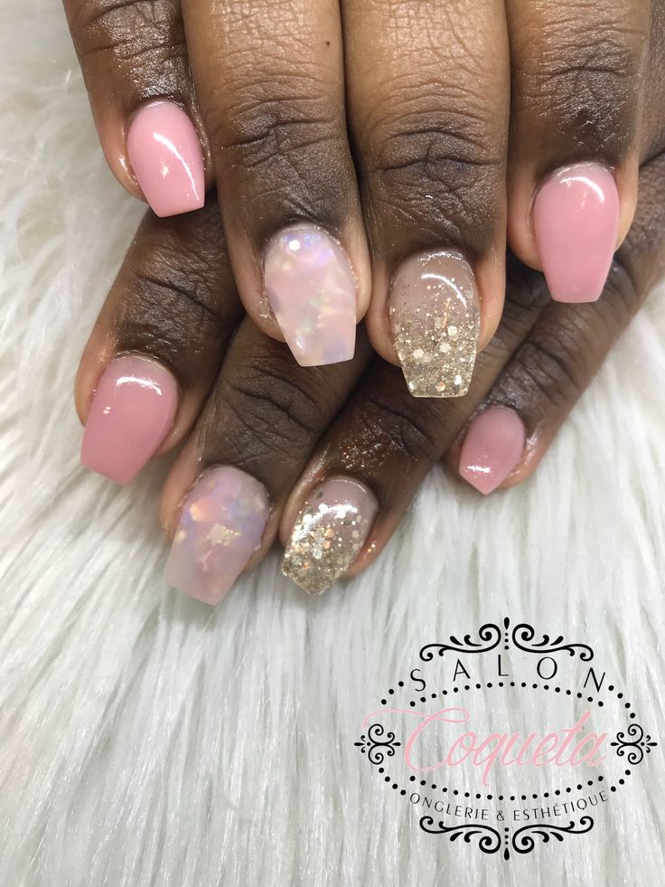 Sophisticated Soft Pink Nail Design with Iridescent Accents and Glitter.