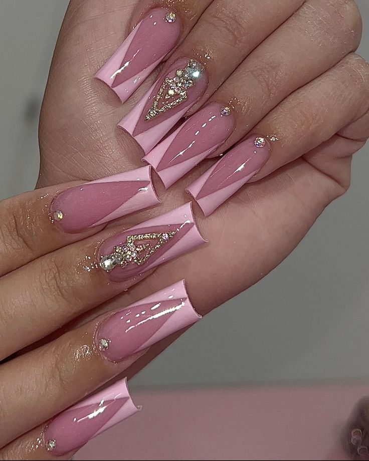 Chic Pink Acrylic Nails with Intricate Designs and Glamorous Accents