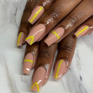 Chic Nail Design: Elegant Geometric Patterns with Vibrant Yellow Accents on a Soft Nude Base.