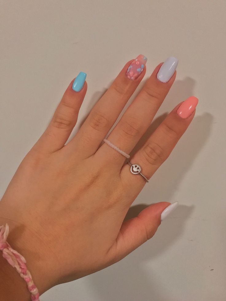 Trendy Colorful Pastel Nail Design with Unique Floral Accents.