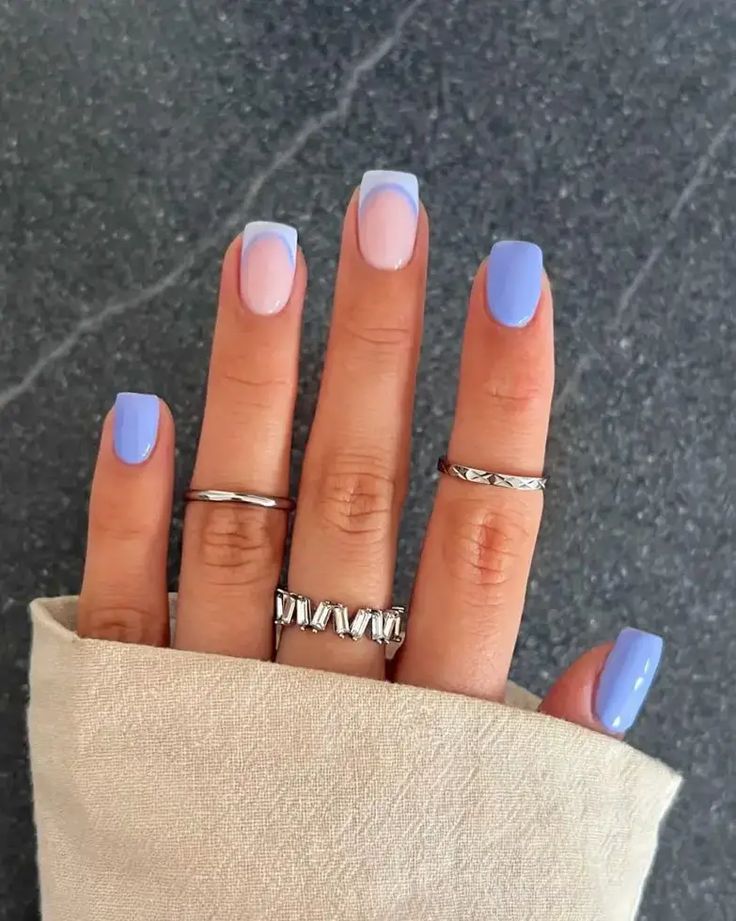 Chic Ombre Nail Design with Pastel Lavender and Pink Accented by Silver Rings.