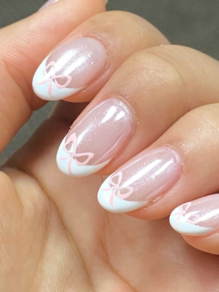 Playful Elegance: Transparent Pink Nail Design with White Tips and Pastel Bows