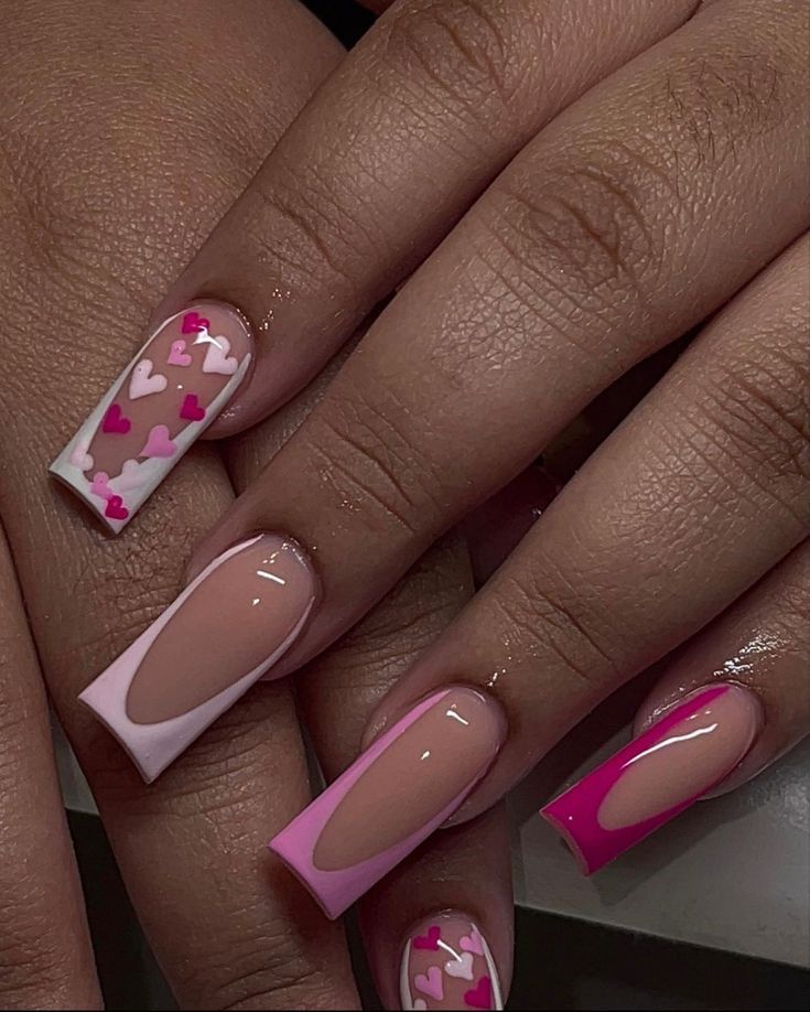 Vibrant Pink and Nude Nail Design with Heart Motifs and Modern Geometric Accents.