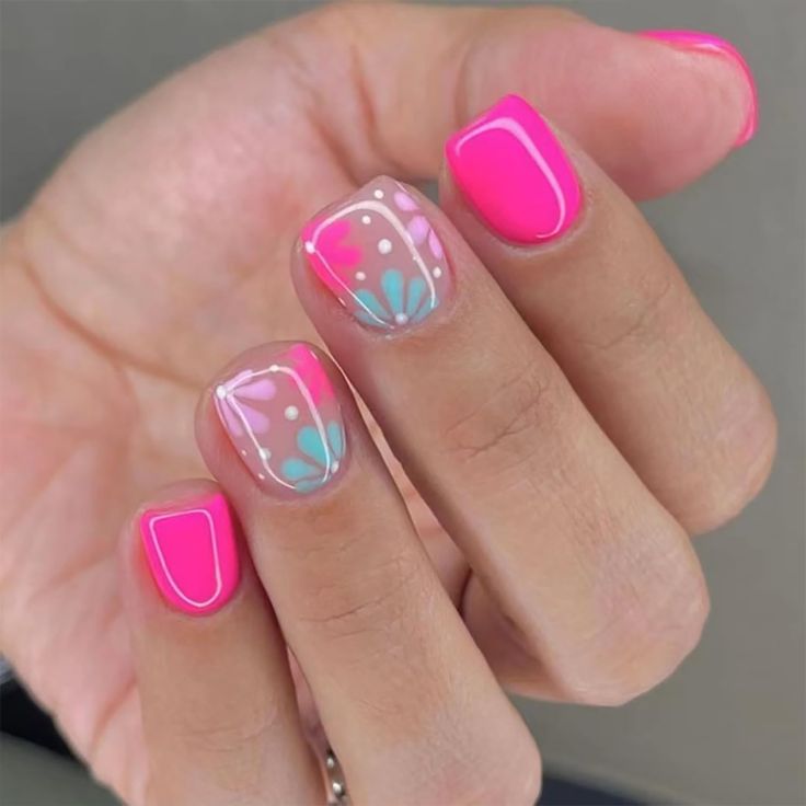 Playful Vibrant Nail Design: Bright Pink with Pastel Floral Accents.