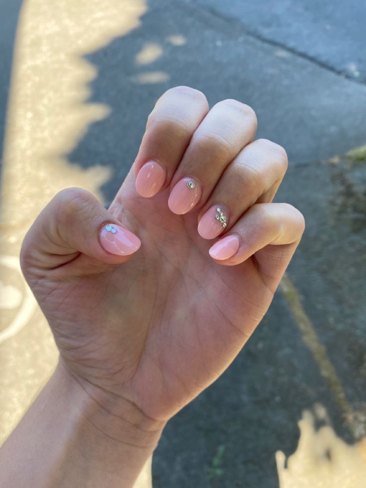 Elegant Pink Almond Manicure with Subtle Sparkle Accents