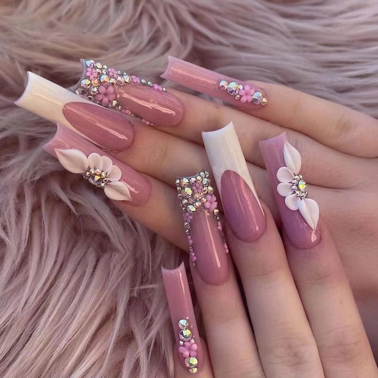 Glamorous Floral Nail Design: Elegant Pink and White Manicure with Sparkling Accents.