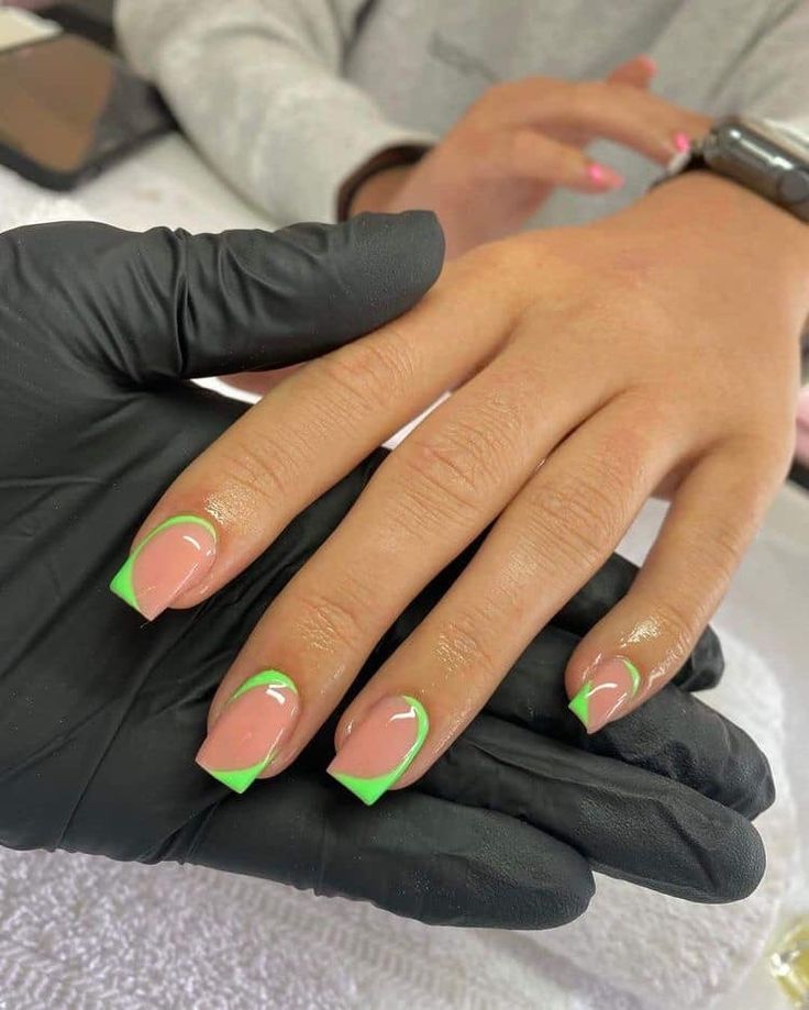 Chic Nude Nails with Vibrant Green Tips for a Fresh and Elegant Look.