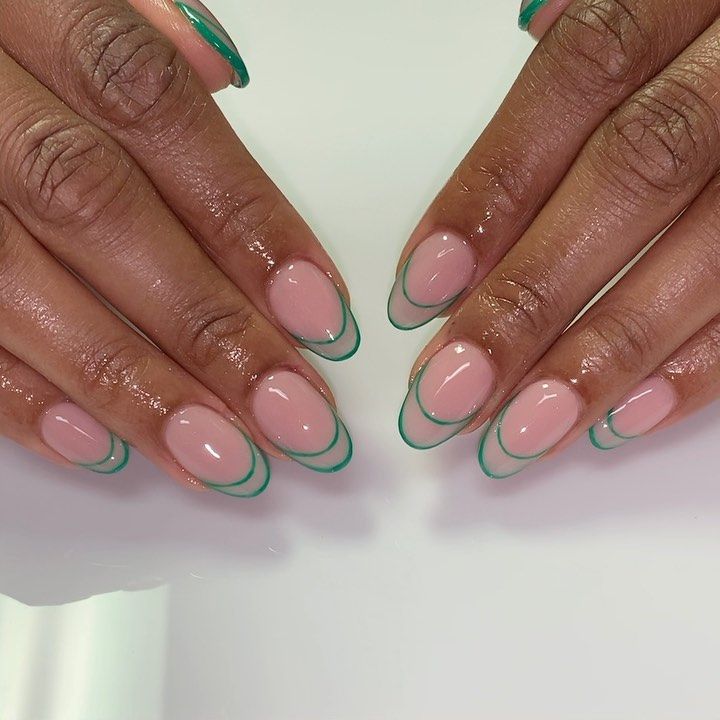 Elegant Soft Pink Nail Design with Delicate Green Outlines for a Fresh Look.