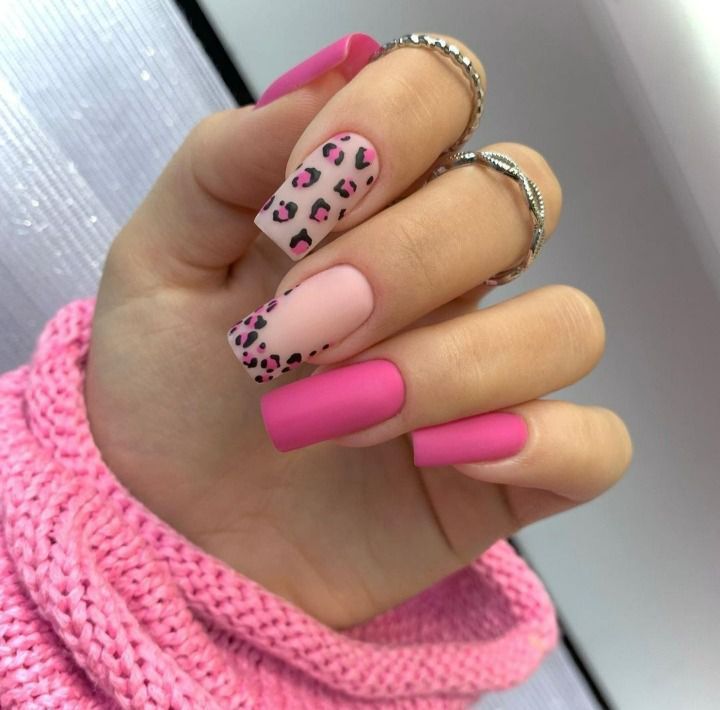 Trendsetting Bold Pink and Leopard Print Nail Design with Matte and Glossy Finish.