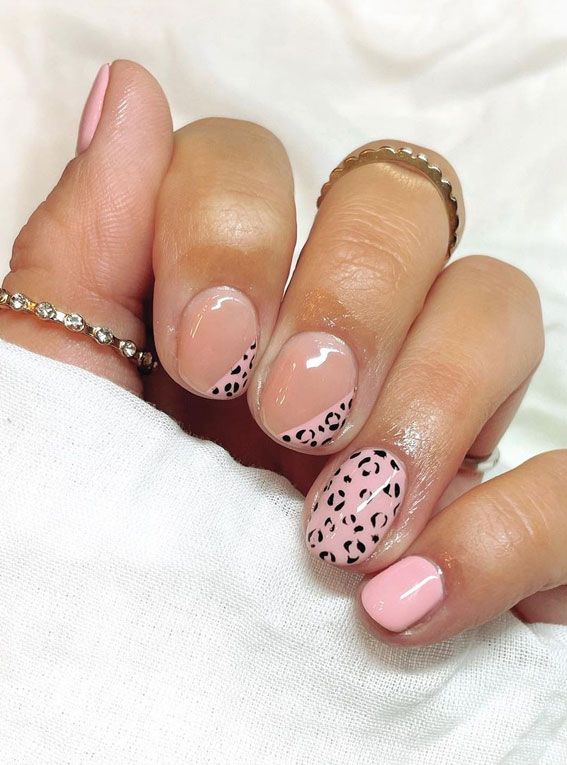 Trendy Chic Nail Design: Soft Pink Base with Playful Leopard Print Accents