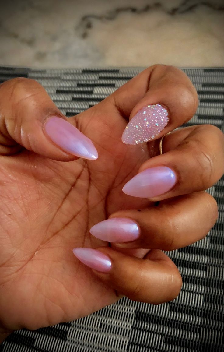 Elegant Stiletto Nails with Soft Ombre Pink and Glitter Accent for a Modern Glamorous Look.