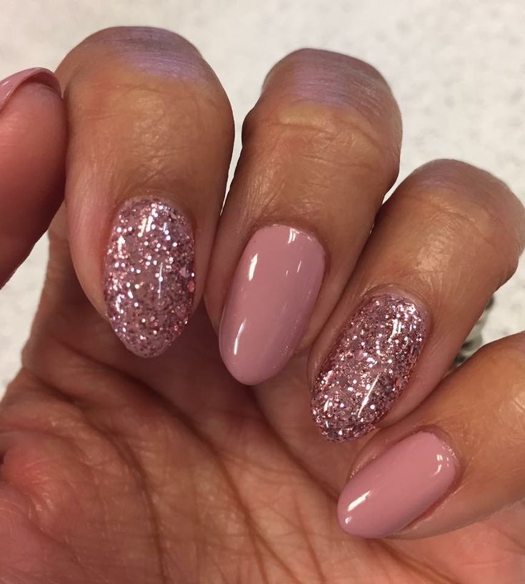 Sophisticated Soft Pink Nail Design with Glitter Accents for Any Occasion