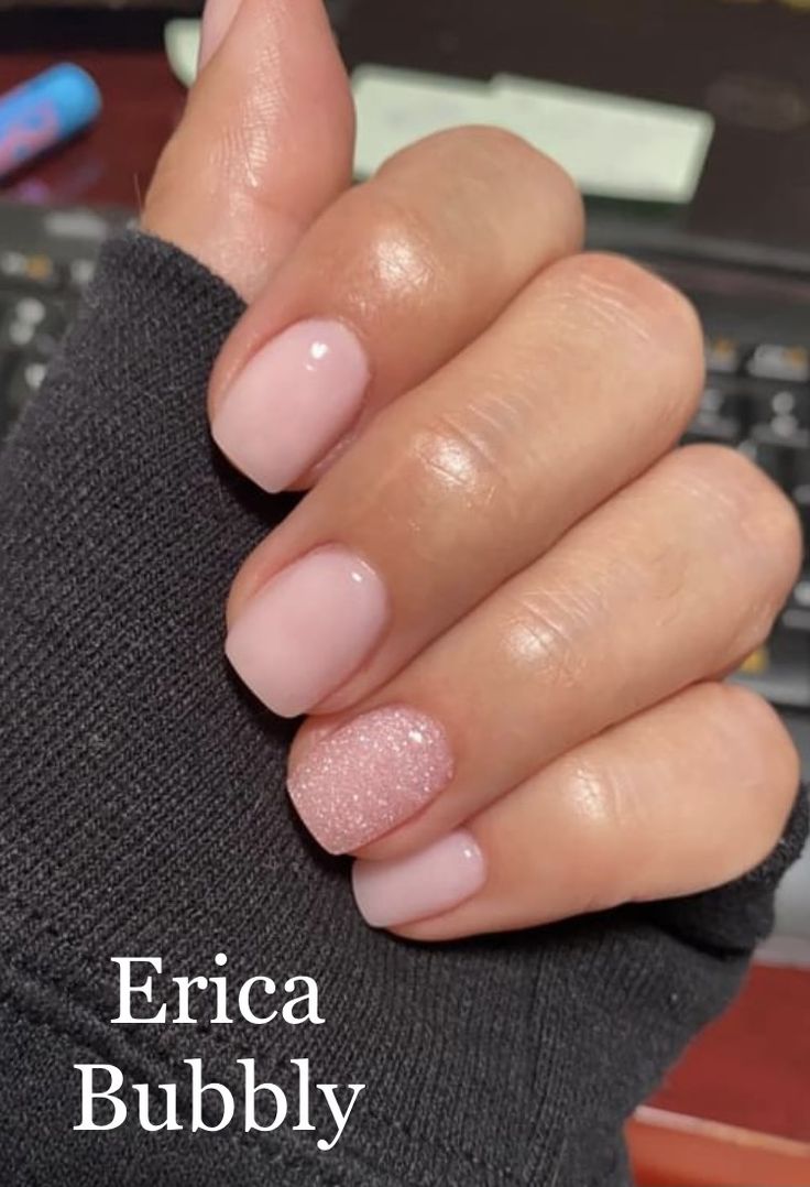 Chic Soft Pink Nail Design with Glitter Elegance and Playful Touch.