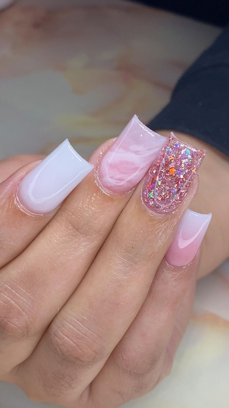 Glamorous Nail Design: Glossy White and Soft Pink with Sparkling Glitter Accents