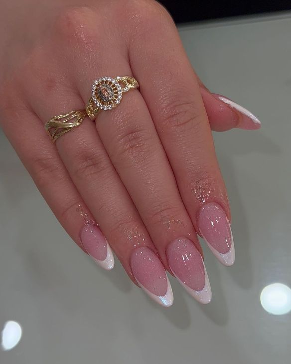 Chic Almond-Shaped French Manicure with Glossy Finish and Gold Accents