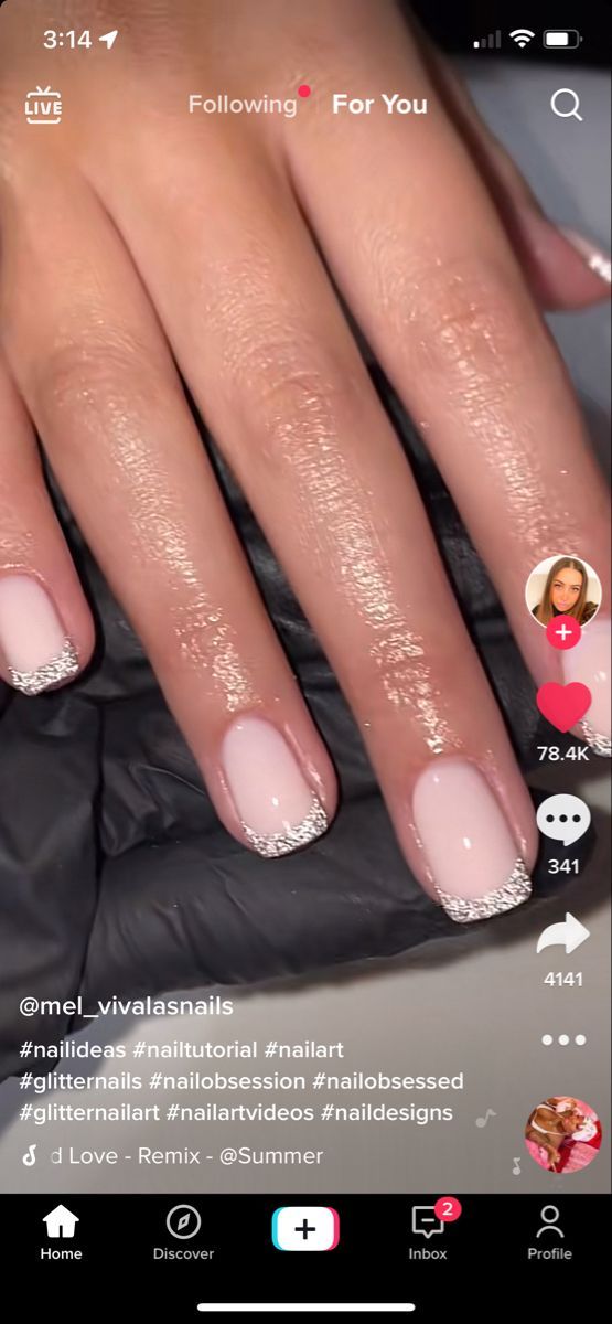 Chic Soft Pink and Glittery White French Manicure: A Feminine Twist for Any Occasion.